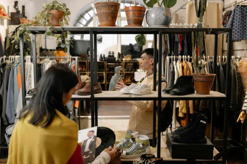 2 people Christmas shopping at the thrift store. 