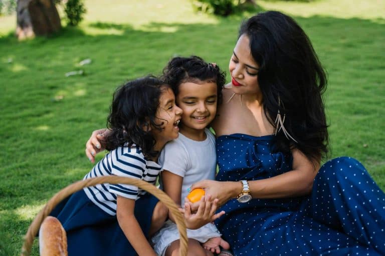 Mom with her two daughters who she can spend more time with due to paying for convenience.