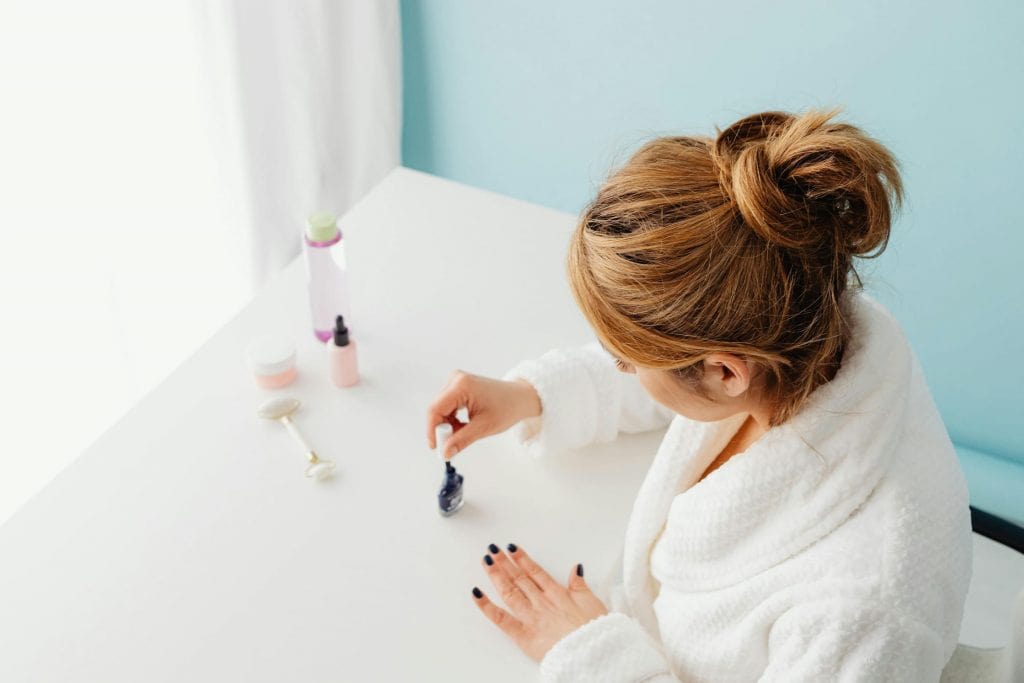 A mom who is pushing back against mommy wine culture and painting her nails as a way to relax at the end of the day.