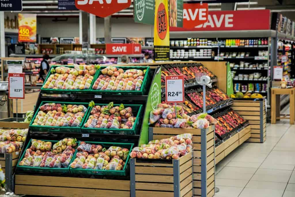 Image of the inside of a grocery store in the produce section