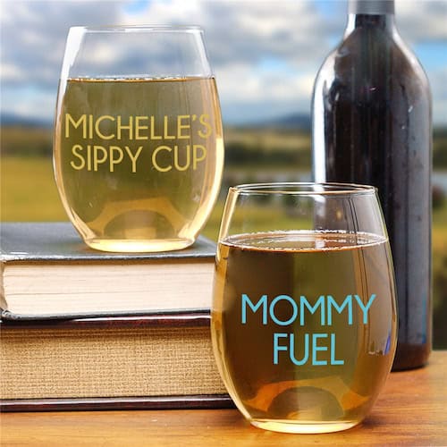Example of mommy wine culture. There are 2 glasses with wine. One says "Michelle's sippy cup" and the other says "mommy fuel".